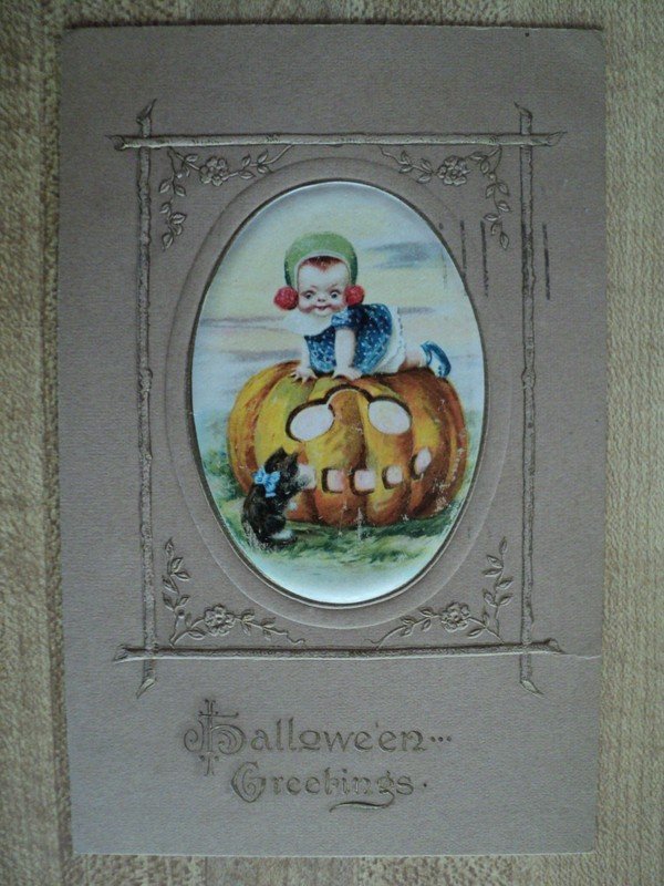 HALLOWEEN Little Girl on Jack-O-Lantern vintage Winsch? embossed Postcard