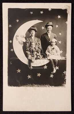 Incredible RPPC of Family on a Paper Moon with Stars in Background. C 1910's
